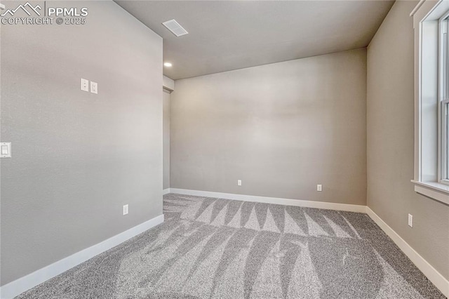 empty room featuring recessed lighting, visible vents, baseboards, and carpet floors
