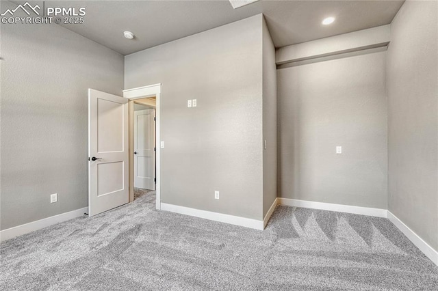 unfurnished bedroom featuring baseboards and carpet floors