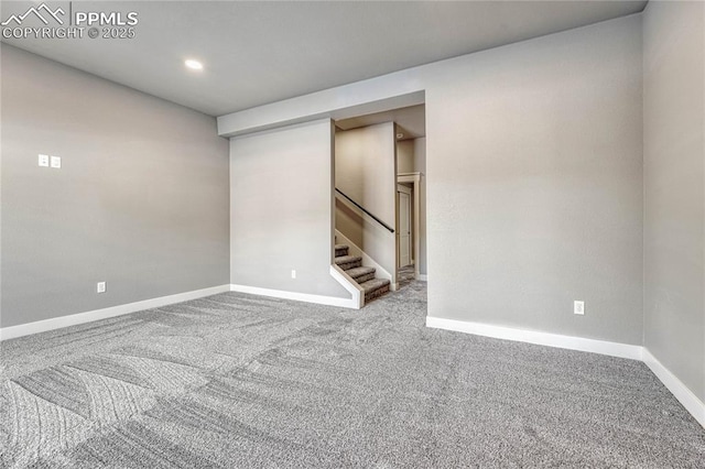 carpeted empty room featuring stairway, baseboards, and recessed lighting