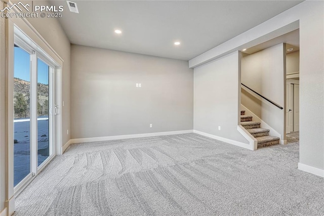carpeted empty room featuring stairs, baseboards, visible vents, and recessed lighting
