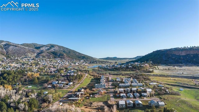 drone / aerial view featuring a mountain view and a residential view