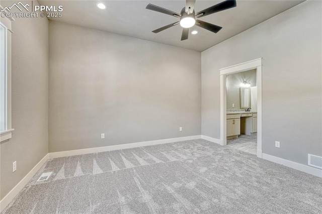 spare room with a ceiling fan, visible vents, baseboards, light colored carpet, and recessed lighting