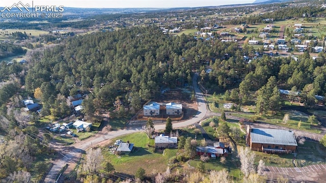 aerial view featuring a forest view