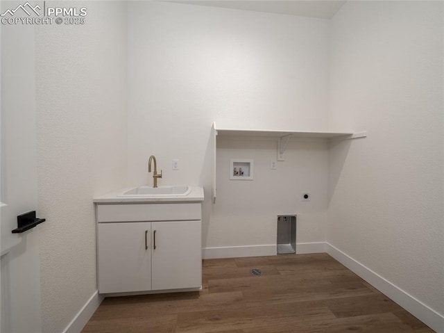 3188 Virga Loop, Colorado Springs, CO 80904 - clothes washing area featuring baseboards, hookup for a washing machine, a sink, wood finished floors, and electric dryer hookup