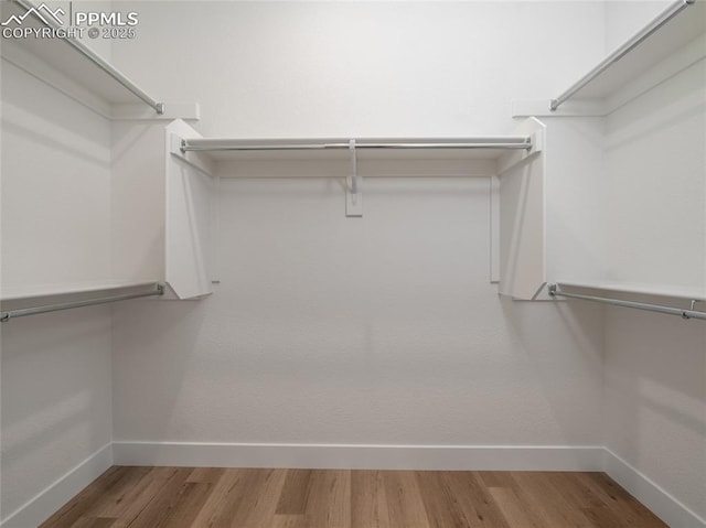 3188 Virga Loop, Colorado Springs, CO 80904 - spacious closet featuring wood finished floors