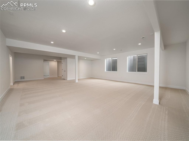3188 Virga Loop, Colorado Springs, CO 80904 - basement with baseboards, recessed lighting, visible vents, and light colored carpet