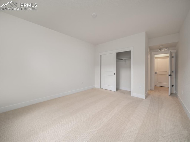 3188 Virga Loop, Colorado Springs, CO 80904 - unfurnished bedroom with light colored carpet, a closet, visible vents, and baseboards