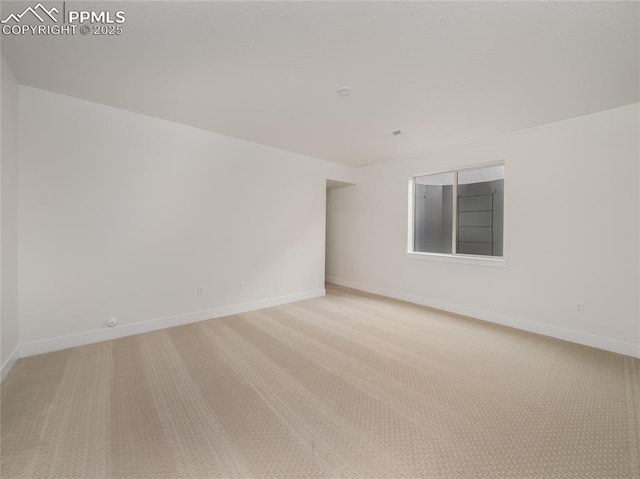 3188 Virga Loop, Colorado Springs, CO 80904 - unfurnished room with baseboards and light carpet