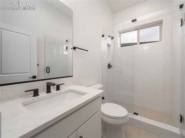 3188 Virga Loop, Colorado Springs, CO 80904 - full bathroom featuring vanity, toilet, and a shower stall