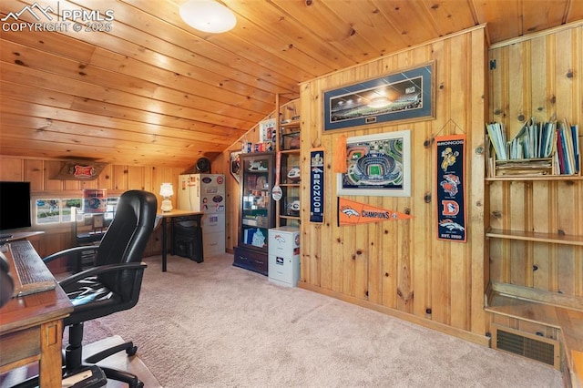 carpeted office featuring visible vents, wood ceiling, wooden walls, and vaulted ceiling
