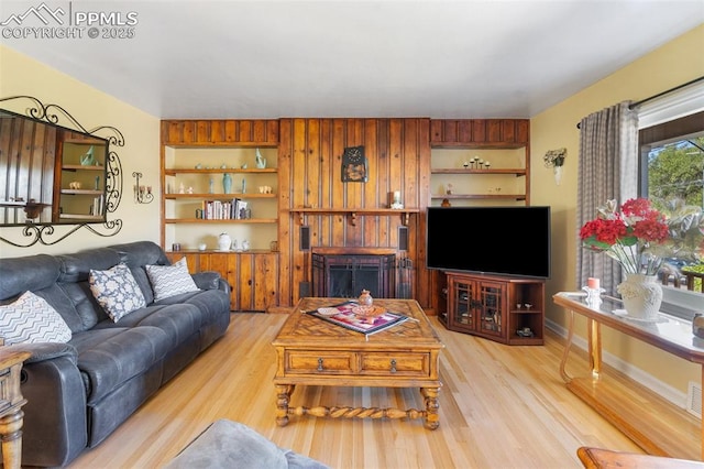 living room with visible vents and light wood finished floors