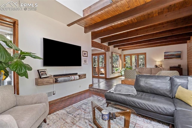 living area featuring baseboards, wood ceiling, beam ceiling, and wood finished floors