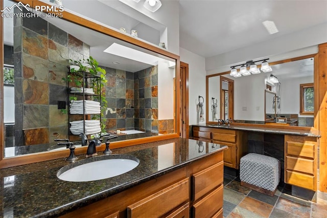 bathroom with stone finish flooring and vanity