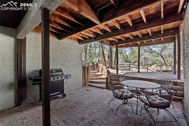 view of patio with outdoor dining space and area for grilling