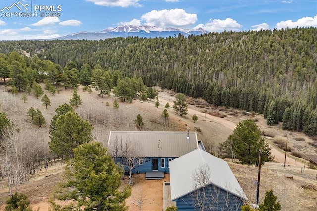 3543 Blue Mesa Dr, Divide, CO 80814 - view from above of property with a heavily wooded area and a mountain backdrop