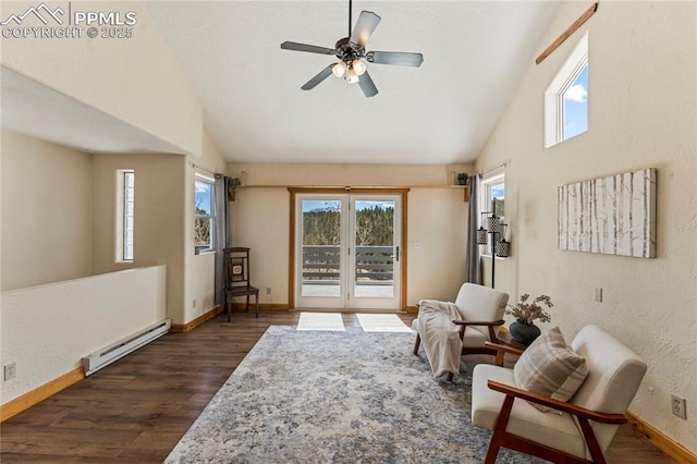 3543 Blue Mesa Dr, Divide, CO 80814 - sitting room with a baseboard heating unit, dark wood finished floors, baseboards, a ceiling fan, and high vaulted ceiling