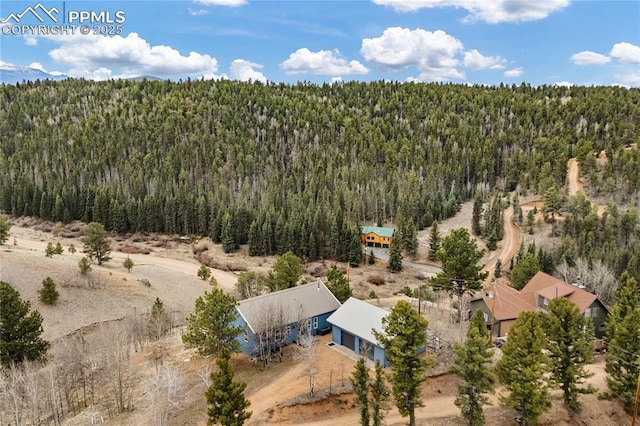 3543 Blue Mesa Dr, Divide, CO 80814 - aerial view of property and surrounding area featuring a heavily wooded area