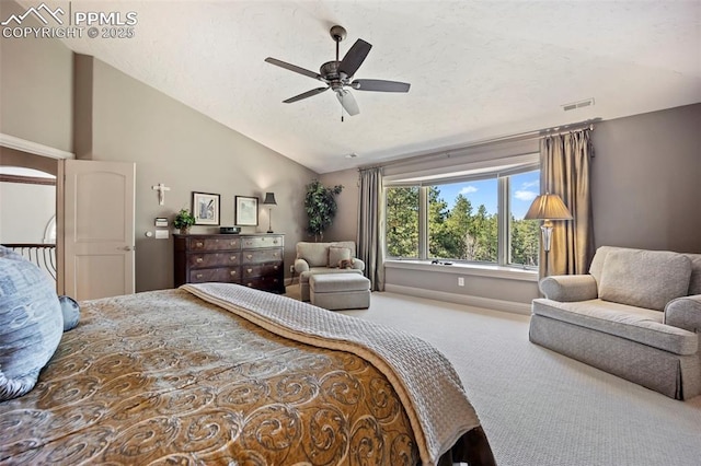 bedroom with carpet floors, a textured ceiling, baseboards, vaulted ceiling, and visible vents