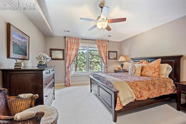 bedroom with visible vents, baseboards, ceiling fan, and light colored carpet