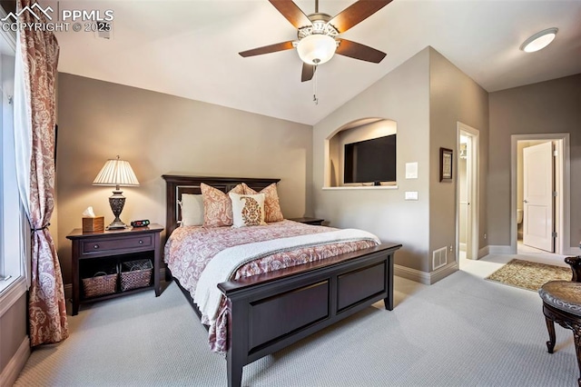 bedroom with ceiling fan, visible vents, light colored carpet, vaulted ceiling, and baseboards