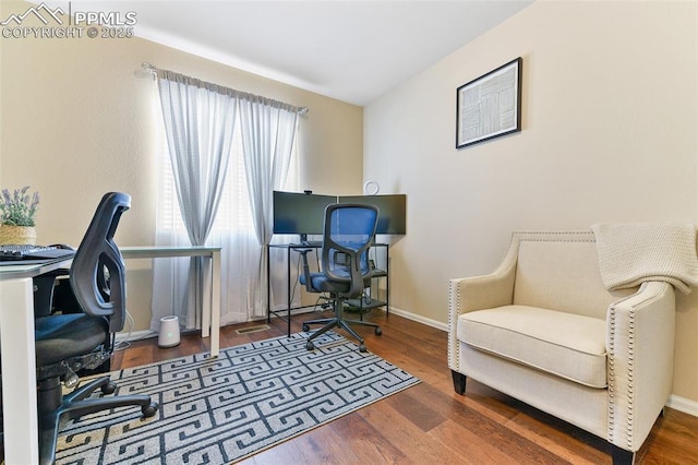office space featuring baseboards and wood finished floors