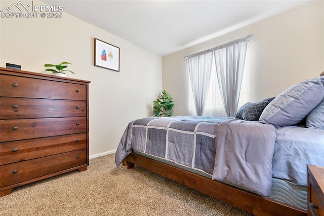 carpeted bedroom with baseboards