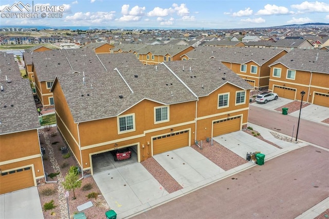 birds eye view of property with a residential view