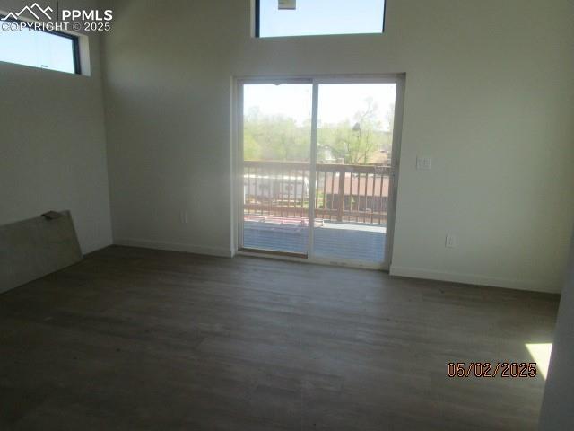 1019 Race St, Colorado Springs, CO 80904 - spare room with baseboards and wood finished floors