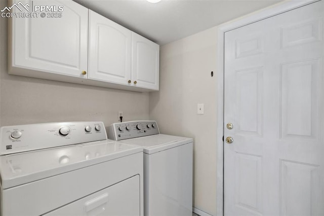 laundry area with cabinet space and washer and clothes dryer