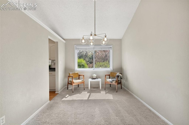 dining space with a textured ceiling, an inviting chandelier, light carpet, and baseboards