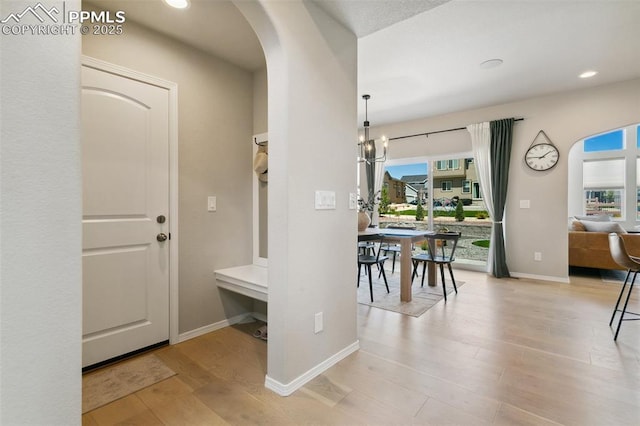 10323 Elevated Ln, Colorado Springs, CO 80924 - interior space with plenty of natural light, wood finished floors, arched walkways, and recessed lighting
