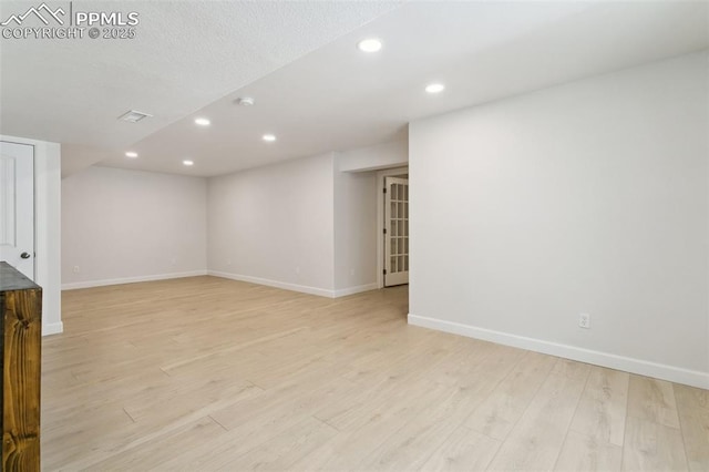 10323 Elevated Ln, Colorado Springs, CO 80924 - below grade area featuring baseboards, light wood-style floors, visible vents, and recessed lighting