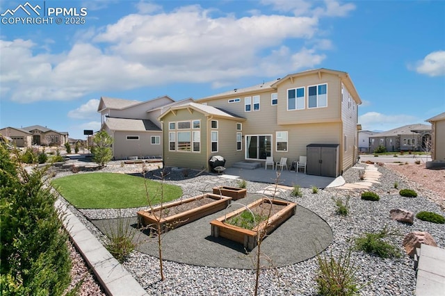 10323 Elevated Ln, Colorado Springs, CO 80924 - back of property with a yard, a patio, a vegetable garden, and a residential view