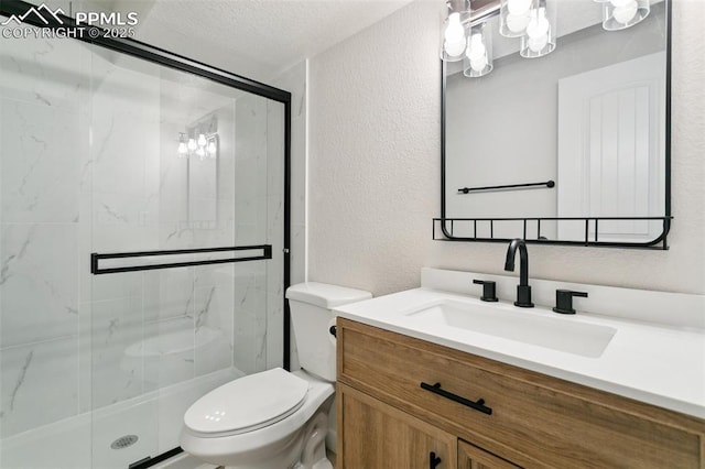 10323 Elevated Ln, Colorado Springs, CO 80924 - full bath with toilet, vanity, a textured ceiling, a stall shower, and a textured wall