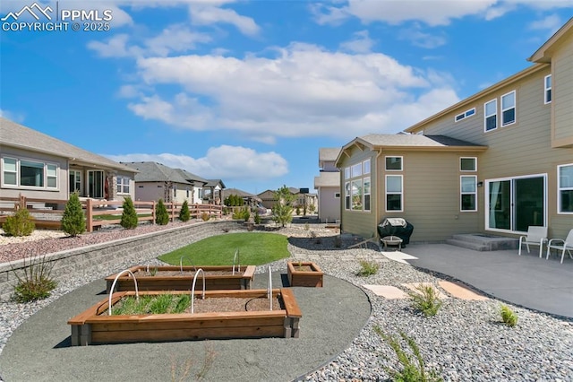 10323 Elevated Ln, Colorado Springs, CO 80924 - surrounding community featuring a garden, a residential view, and a patio area