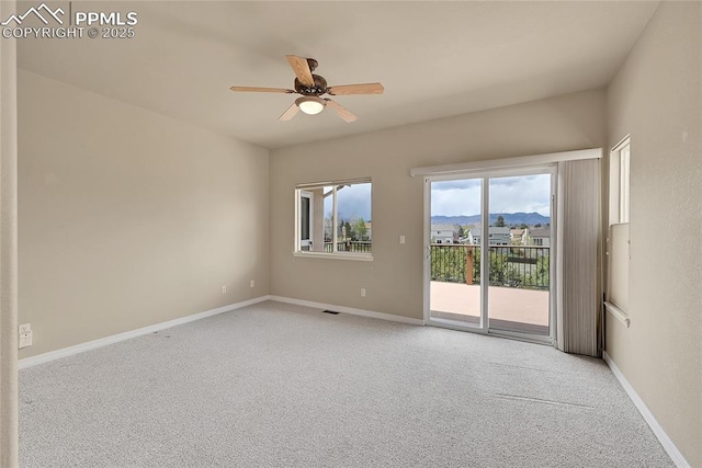 unfurnished room featuring ceiling fan, light carpet, and baseboards