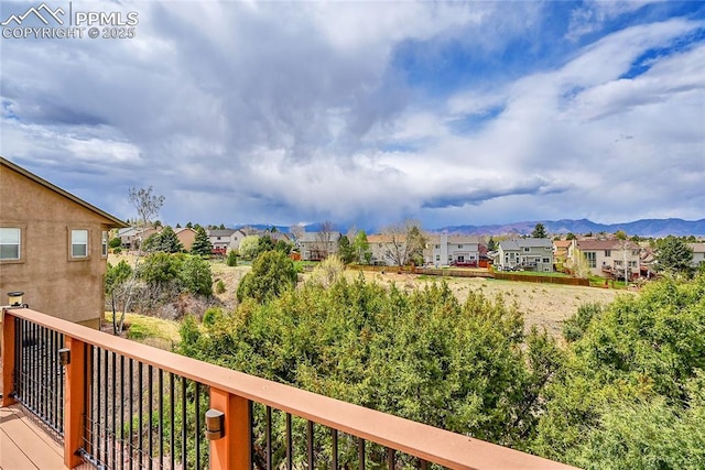 balcony featuring a mountain view and a residential view