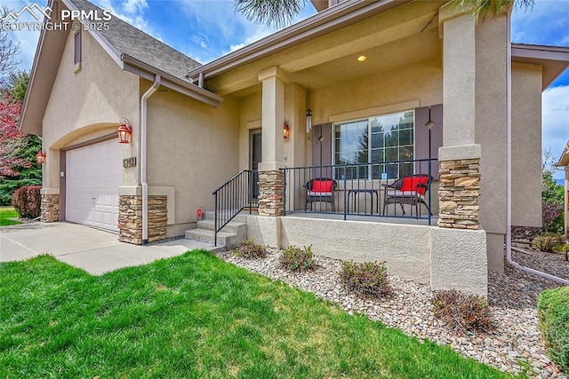 entrance to property featuring an attached garage, stucco siding, concrete driveway, and stone siding