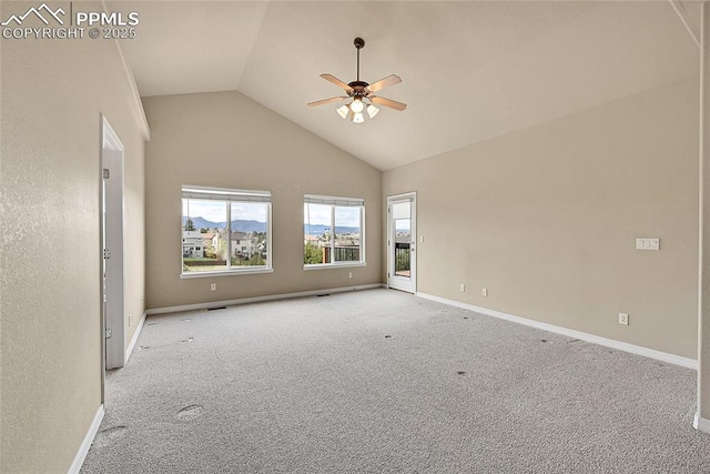 carpeted spare room with high vaulted ceiling, ceiling fan, and baseboards