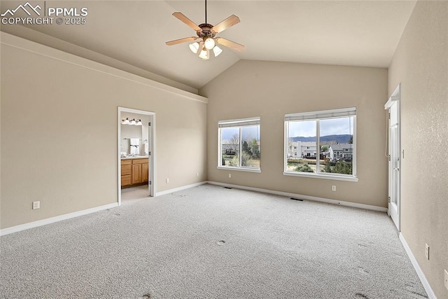 unfurnished room with visible vents, light carpet, baseboards, ceiling fan, and high vaulted ceiling