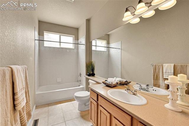 bathroom featuring vanity, tile patterned floors, toilet, and bathing tub / shower combination