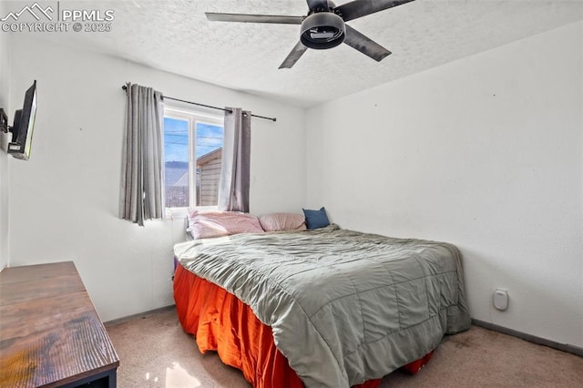 2246 Bison Dr, Colorado Springs, CO 80911 - bedroom featuring ceiling fan, carpet flooring, and a textured ceiling