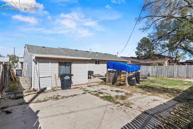 2246 Bison Dr, Colorado Springs, CO 80911 - rear view of house featuring roof with shingles, a fenced backyard, and a patio area