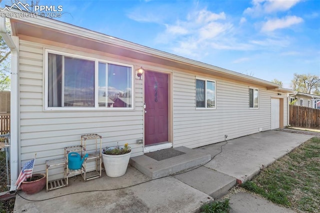 2246 Bison Dr, Colorado Springs, CO 80911 - view of front of home with fence and a patio area