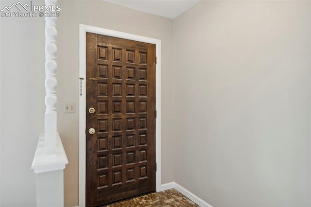 entryway featuring baseboards
