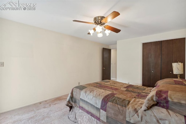 bedroom featuring a closet, ceiling fan, and light carpet