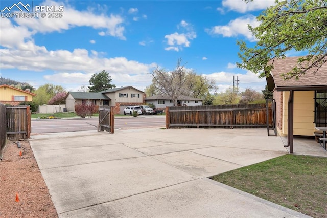 exterior space with fence and a residential view