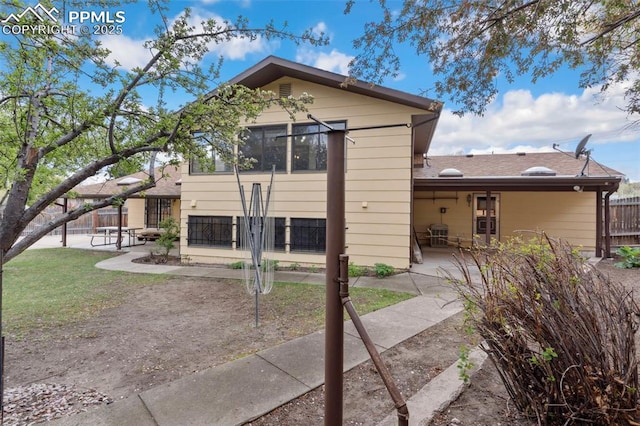 exterior space with fence and a patio