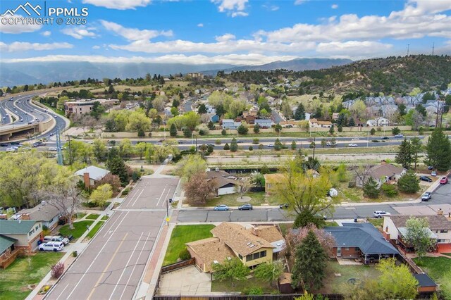 birds eye view of property with a residential view and a mountain view