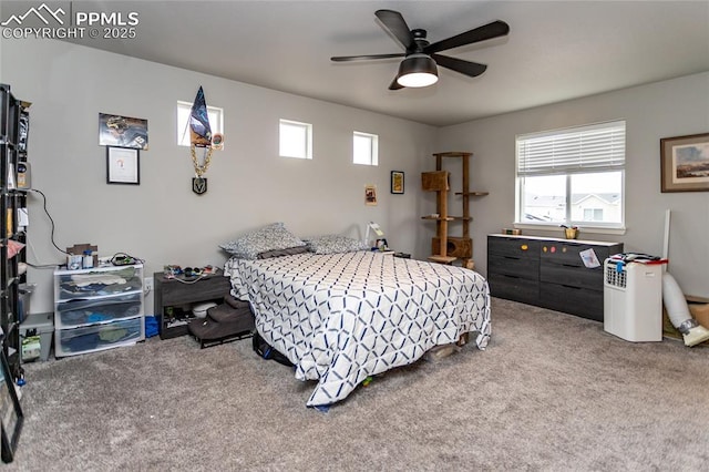 carpeted bedroom with a ceiling fan